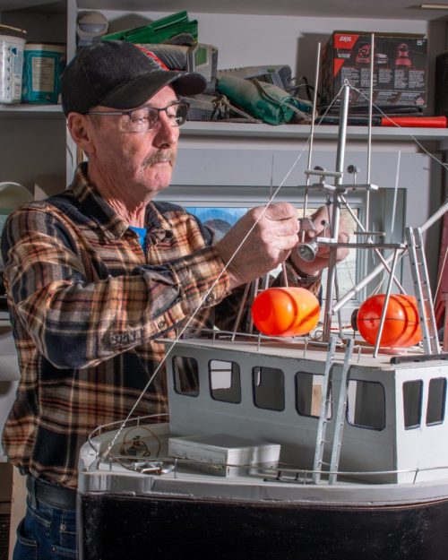 man making model boat