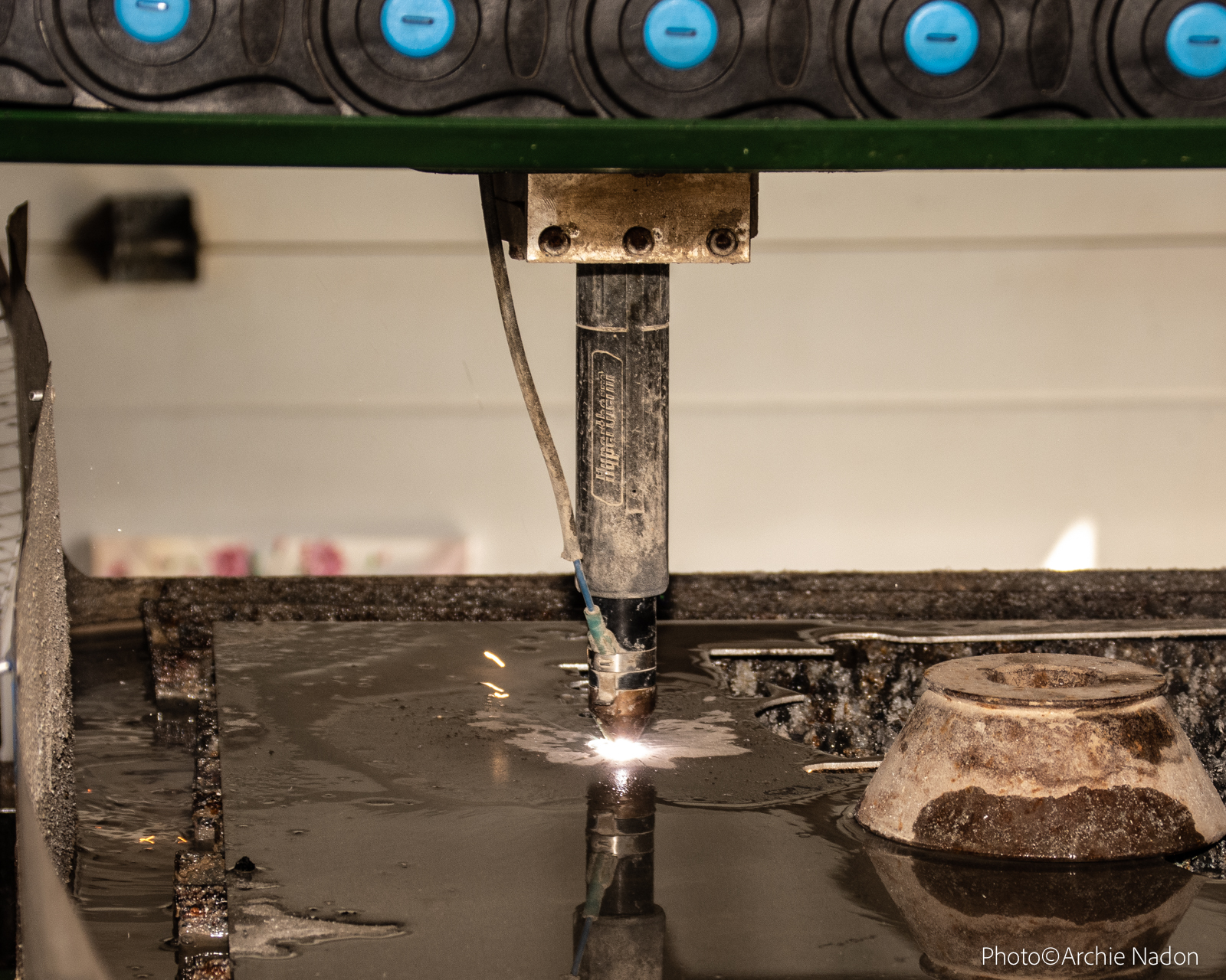 Their CNC plasma cutter uses 220, single phased power with 90-100 pounds air pressure to cut through metal.