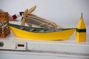 yellow wooden boat and bouy