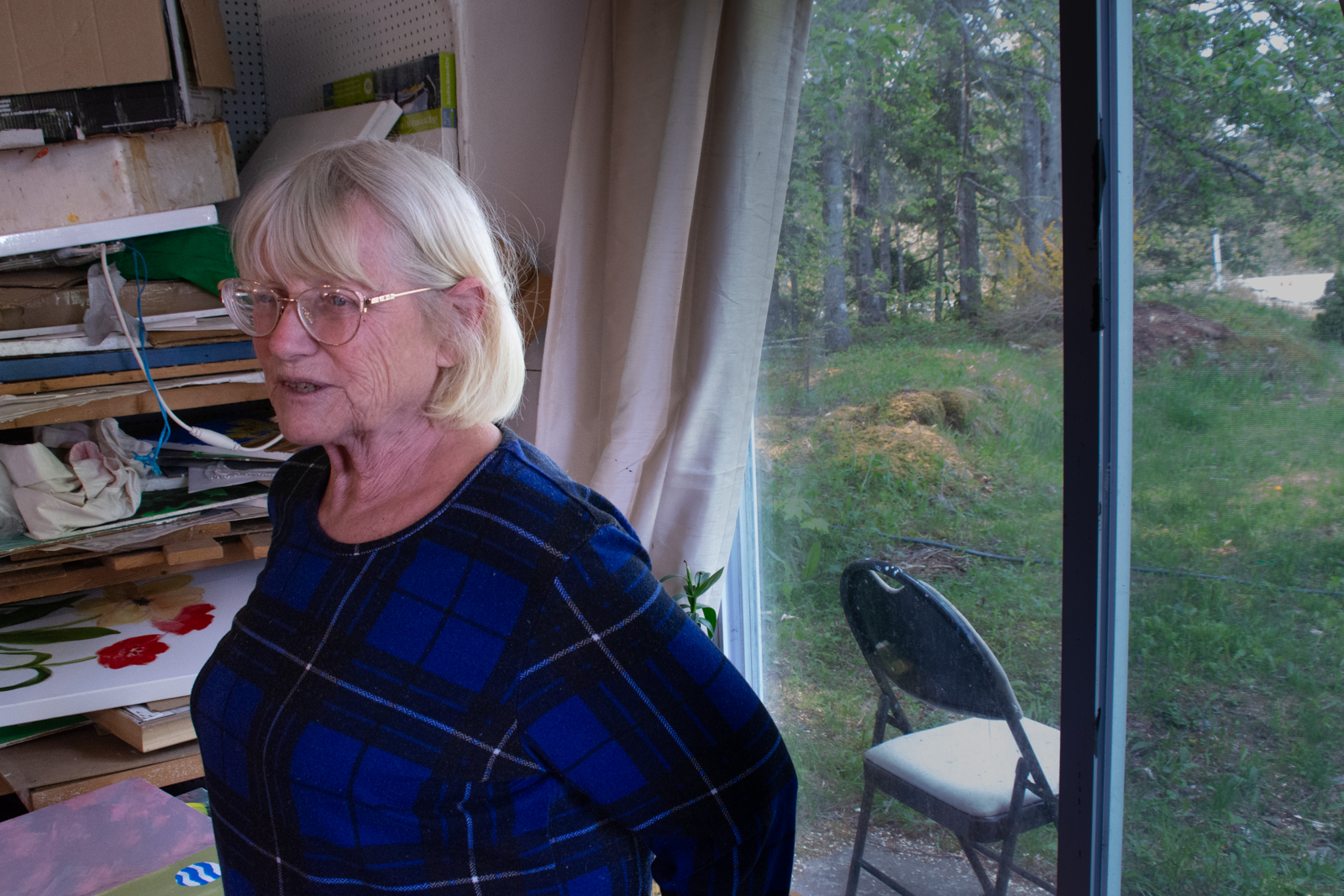 Catherine Moir in her studio by her house in Sydney Forks, NS.