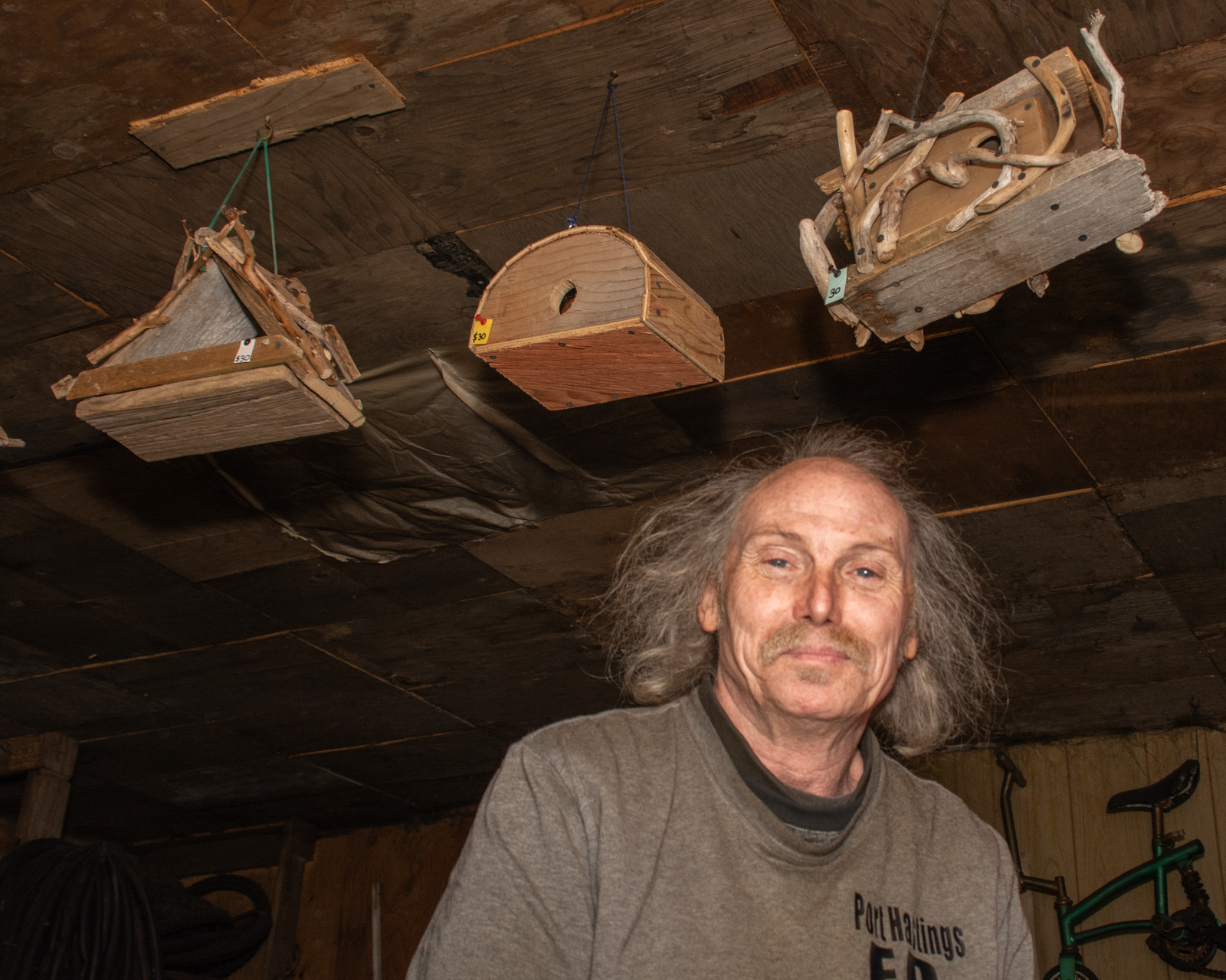 Bernie with some of his birdhouse creations. You can see evidence of his beach combing both in the materials of the birdhouses, but the shop wall and ceiling covering. It would be hard not to admire that kind of perseverance and resourcefulness