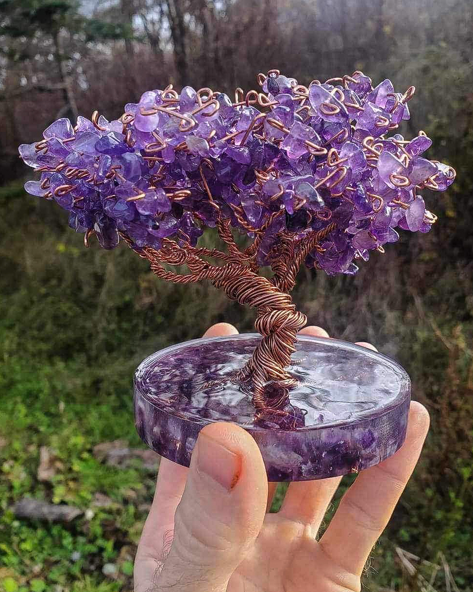 A copper, resin and amethyst tree sculpture.