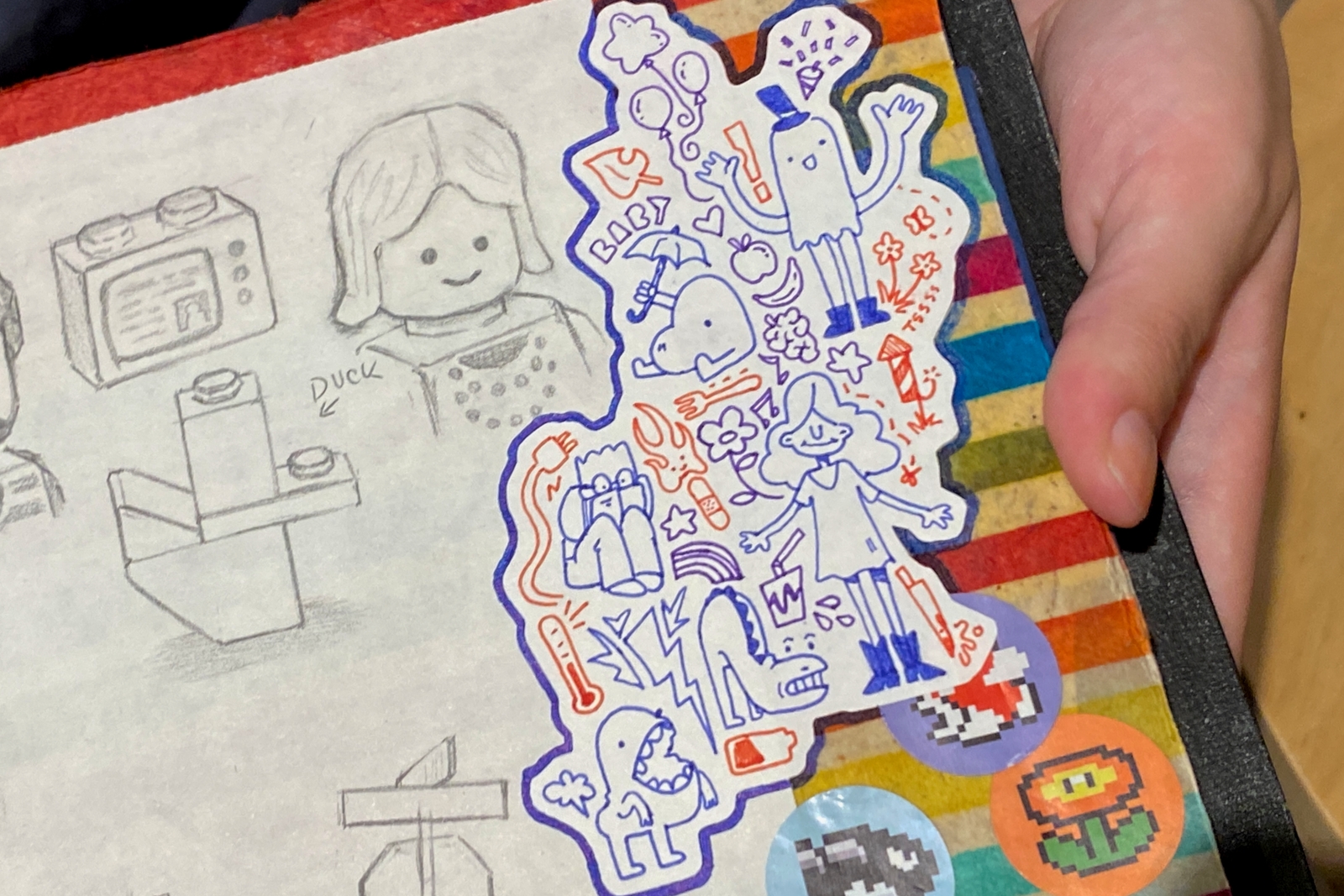 From classic Lego characters to whimsical doodles, her homemade sketchbooks are filled with what intrigues at the moment.